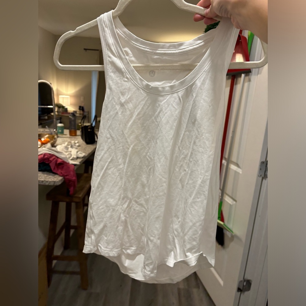 White lululemon tank top for working out. So comfortable